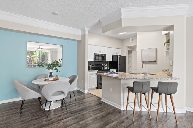 Kitchen and Dining Table at Verona at Boynton Beach Apartments in Boynton Beach, FL 33426 - Verona at Boynton Beach Apartments