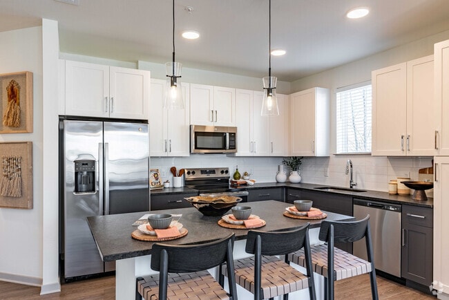 Sleek modern kitchen with stainless steel appliances. - Livano Nations Rental