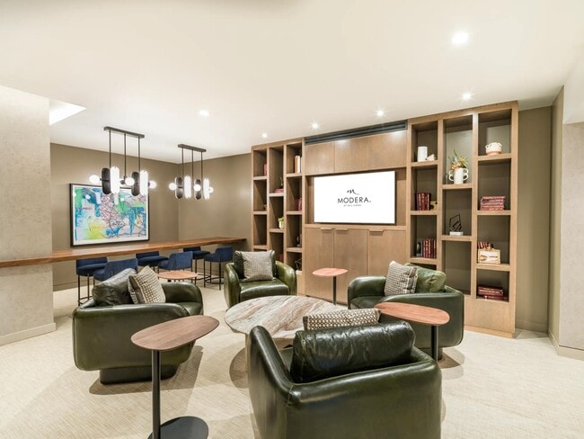 A coworking lounge, complemented by a private conference room and two private offices, offers residents a versatile workspace within the community.