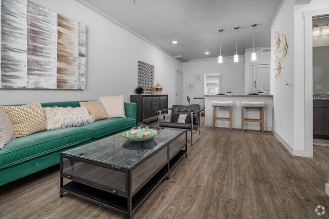 1BR, 1BA - 859SF - Living Room with Wood Inspired Flooring