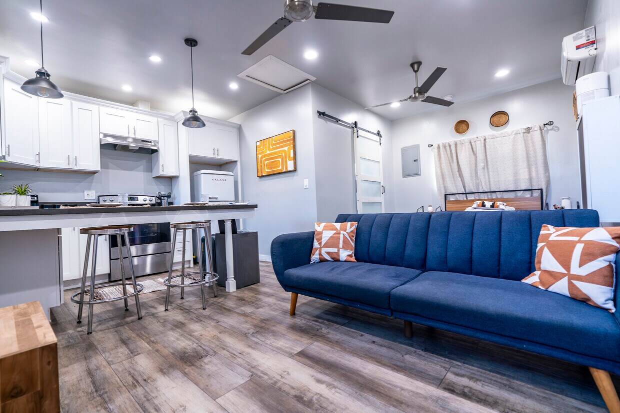 View from entrance, features one-click sofa bed, and full view of unit. barn door leads to bathroom. - 6403 Arlington Ave (Los Angeles, CA)