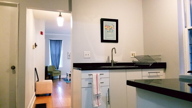 Full size kitchen looking towards living room - 522 N 15th St Unit 1