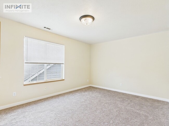 Photo - Bright & Spacious 2 Bedroom, 2 Bath Condo with Single Detached Garage – Move-In Ready!