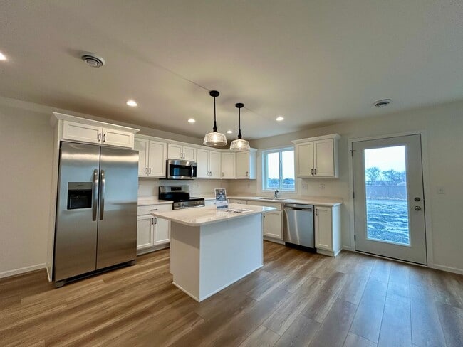 Photo - Spacious & Stylish 3-Bed Home with Modern Finishes and Attached 2-Stall Garage