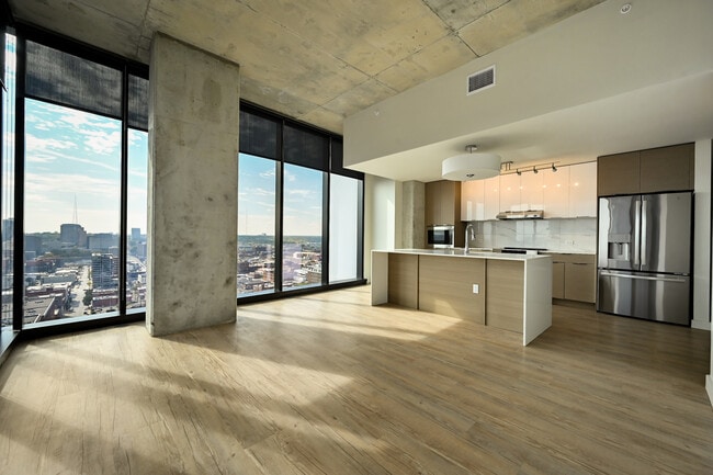 The living room and kitchen of The Page at Three Light Luxury Apartments