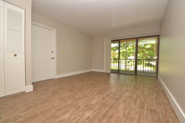 Photo - Nicely Updated 1/1 Condo in Winter Springs ~ Wood Plank Tile Floors and Large Screened Patio! Unit 4