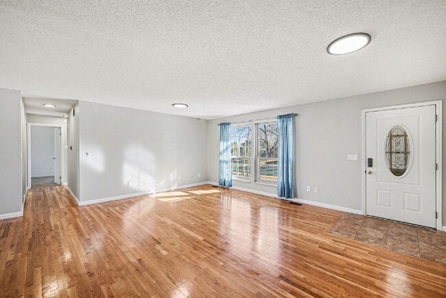 Photo - "Spacious 4-Bed Lakewood Gem with Hardwood Floors, Finished Basement & Fireplace - 2970 Sq Ft!"