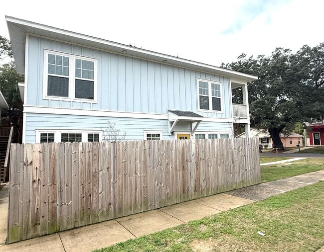 Photo - **Available now. This pet-friendly property features a small fenced yard with water and lawn main...