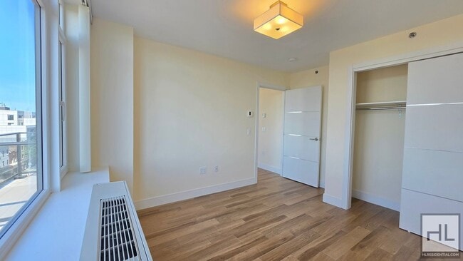 Photo - Top-Floor 1-Bedroom with Private Balcony & Manhattan Skyline Views! Unit 7B
