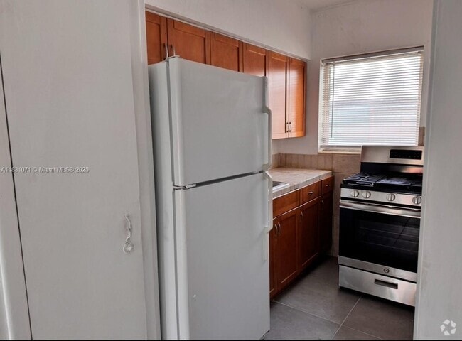 Building Photo - 7717 Byron Ave Unit 12A Rental