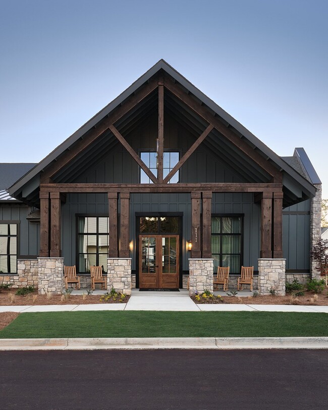 Clubhouse exterior with ample parking for future residents and visitors.