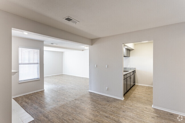 2BR, 1BA - 1059 SF - Living Room and Kitchen - Lakeside Village