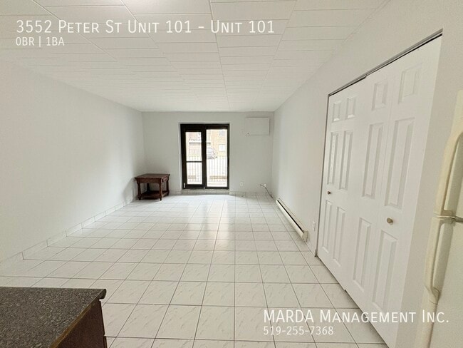 Building Photo - COZY MAIN FLOOR BACH NEAR U OF W - INCLUSIVE! Unit 101