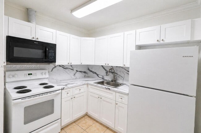 Building Photo - 7190 W 11th Ct Unit 4