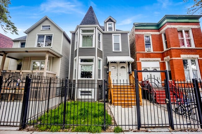 Building Photo - 1821 N Tripp Ave Unit 2