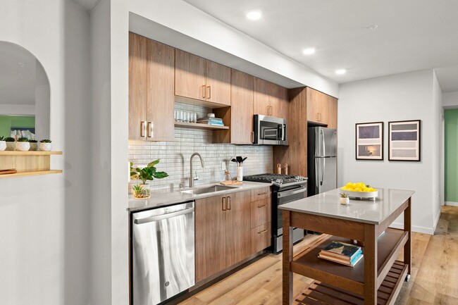 Moveable kitchen islands with storage or pull-up bar seating - Modera Overlake Apartments