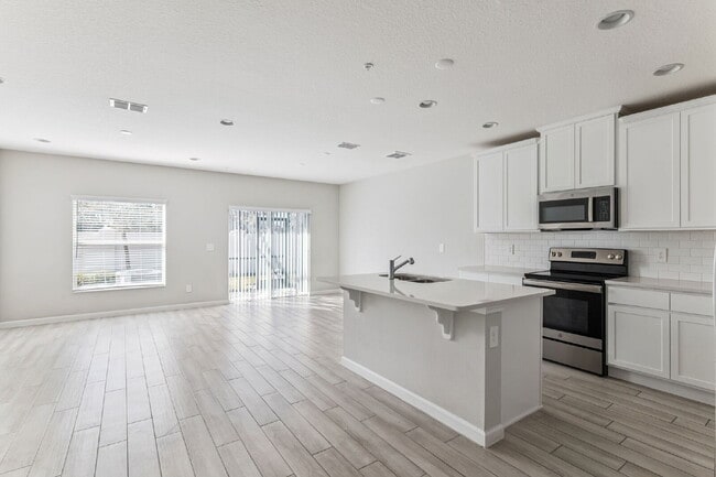 Photo - Stunning 3 bedroom, 2.5 bathroom townhome located in a highly desirable gated community