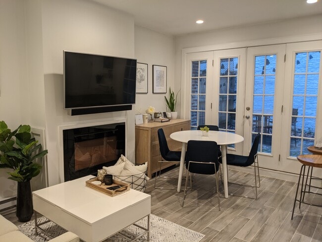 Living area opening into private patio - 12 Melrose St Unit 1