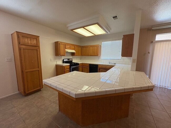 Photo - Coming Soon: Spacious 3 Bedroom, 2 Bath Tevis Ranch Home with Fireplace, Covered Patio & 2-Car Ga...