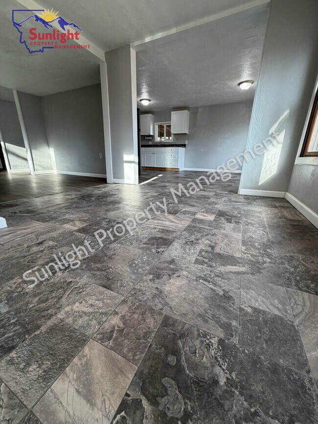 Photo - Spacious 5-Bedroom Home with Open Layout, Off-Street Parking & Large Backyard