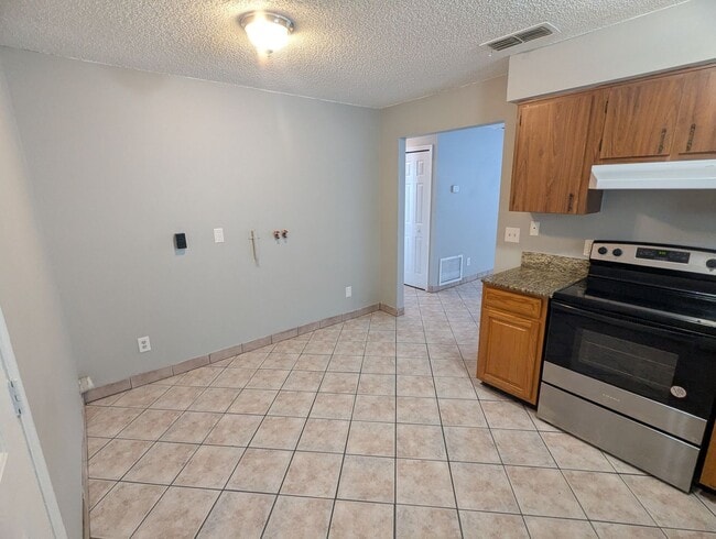 Photo - Spacious 2-Bedroom, 1-Bath First-Floor Condo for Rent. Furry friends welcome! Unit 6