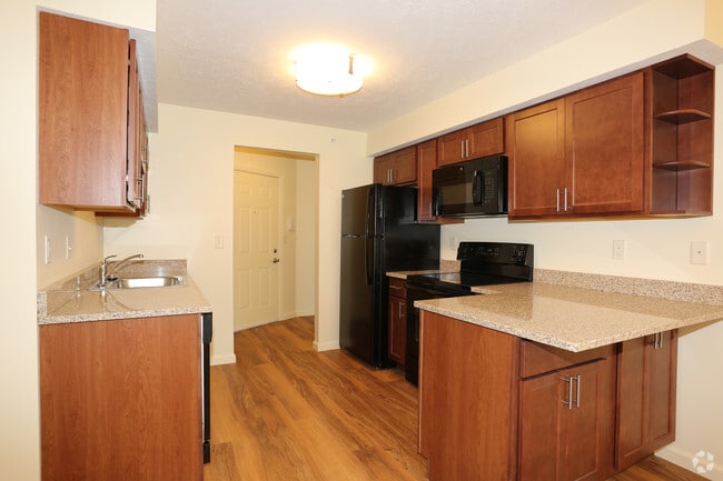 Kitchen Area Complete With Granite Countertops