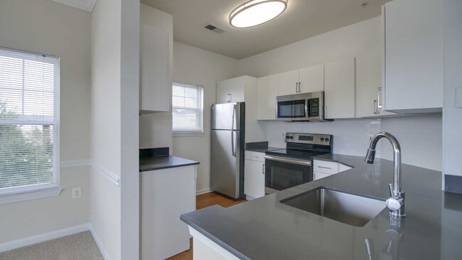 Kitchen with Stainless Steel Appliances - Reserve at Potomac Yard Apartments