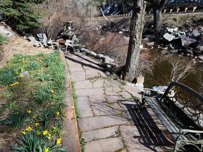 Creek-side flagstone patio with outdoor barbeque - 100 Canon Park