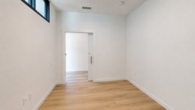 Minimalist bedroom with sliding door