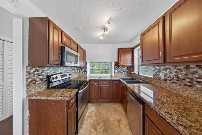 Building Photo - 6070 NW 64th Ave Unit 212 Rental