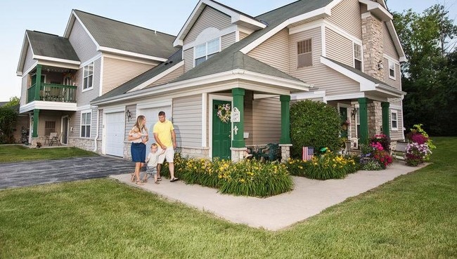 Condo-style community with attached garages, private entries, and yard space