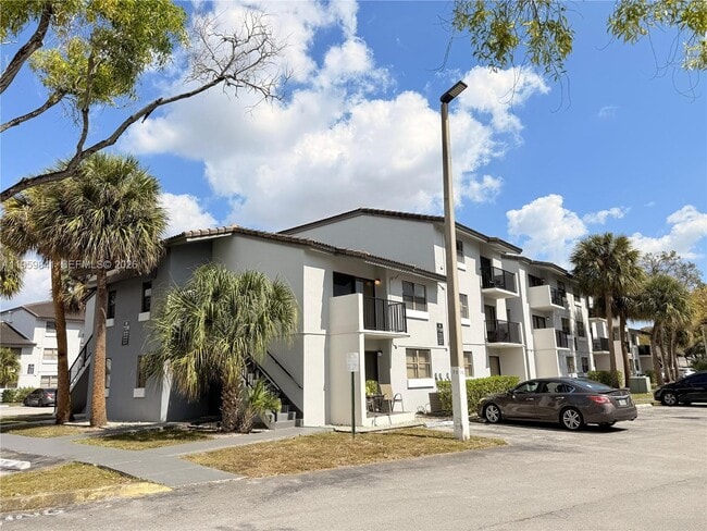 Building Photo - 7130 NW 179th St Unit 212