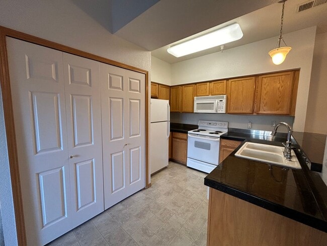 Photo - Bright 2-Bed Condo with Vaulted Ceilings, Garage & Balcony
