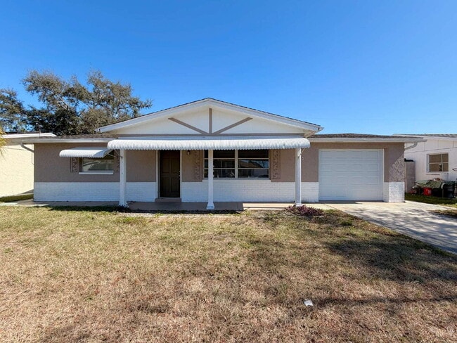 Building Photo - New Port Richey Home with Cozy 970 Sq Ft Layout!