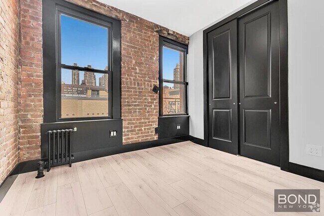 Building Photo - 438 W 52nd St Unit 12E Rental
