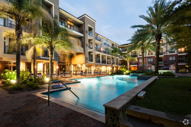 Resort-Inspired Pool with Sun Ledge, Lap Pool, and Waterfall. - The Atlantic Memorial Rental
