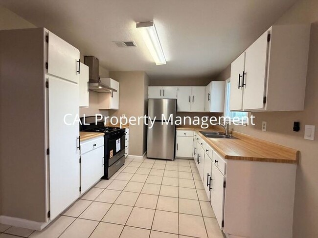 Photo - Spacious 4-Bedroom Home with 2-Car Garage & Backyard Oasis