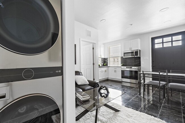 Living room with Washer/Dryer unit - 1009 8th street Apartments