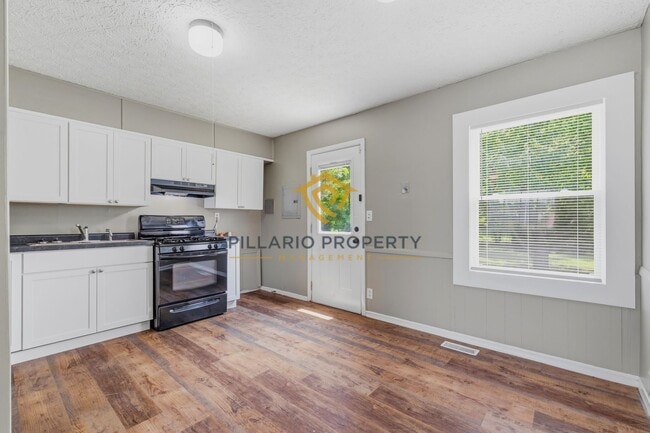 Photo - Charming 3-Bedroom Near Downtown with Fenced Yard & Garage Available NOW!