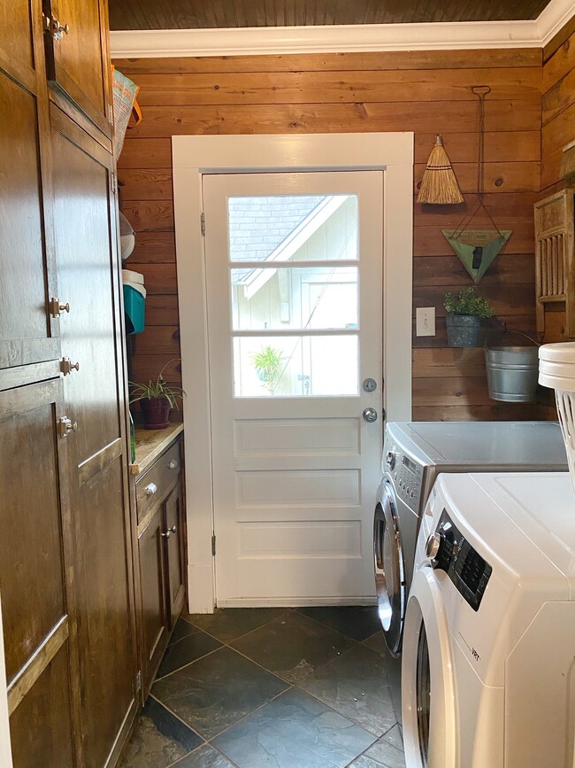 Laundry room with pantry and storage. - 1003 Egan St