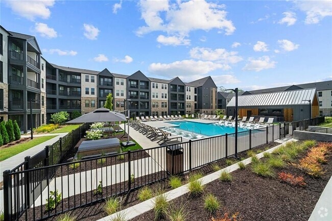 Building Photo - 7000 Renaissance Pkwy Unit A1 Rental