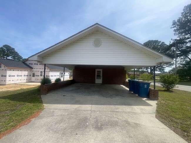 Photo - Brick Ranch- Dunn- 4 bedroom 2.5 bath- 2 car carport- Corner Lot