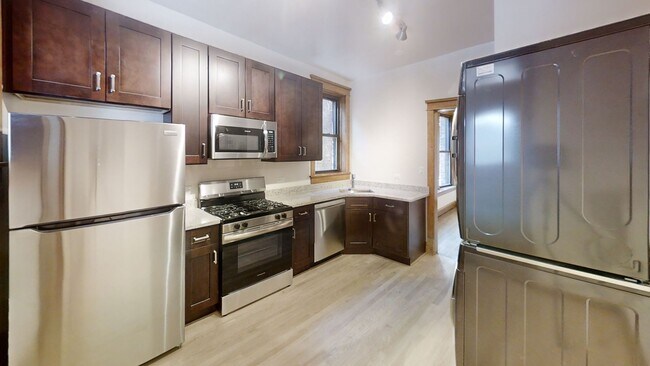 Photo - Lakeview Gem: 2 Bed, 1 Bath W/ In-Unit Laundry, D/W, Cent Air, Fireplace, Deck, Parking! Unit 1417-1