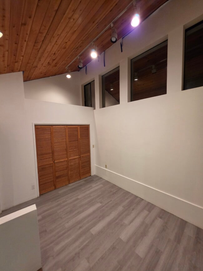 Dining room with closet and elevated storage area (main floor) - 2635 Hollyridge Dr