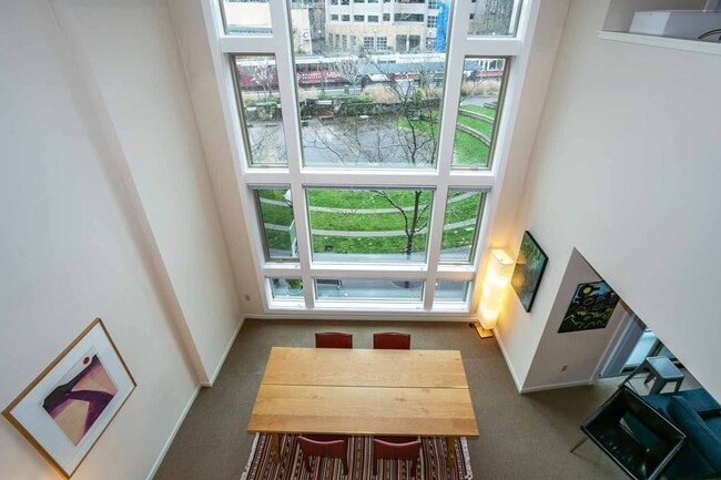 Photo - Gorgeous loft-style 2 floor condo with secured parking, A/C and rent includes most utilities! Unit 221