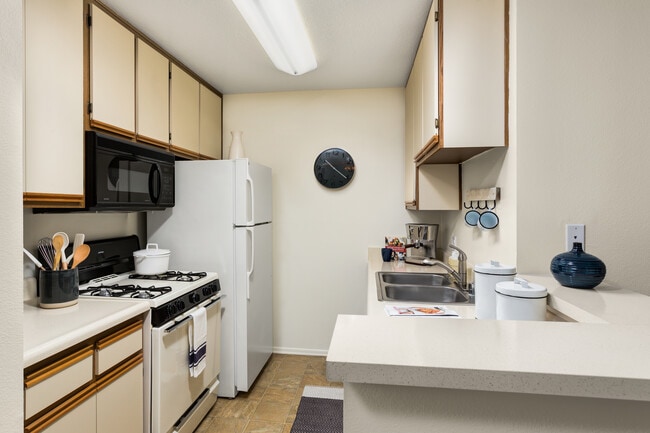 Classic I kitchen with white-on-white appliances and breakfast bars