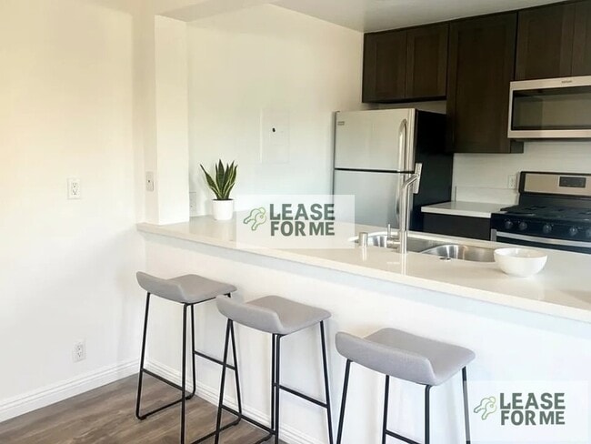 Building Photo - 8526 Cashio St Unit 101