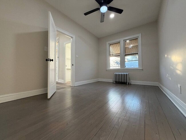 Photo - Spacious 5BR/2BA Home with Basement & Off-Street Parking