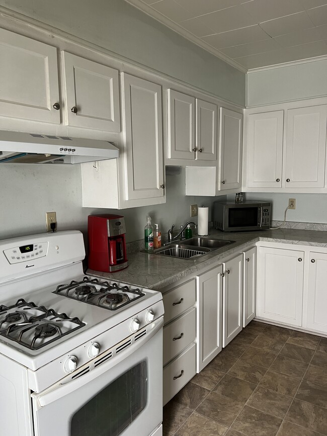 Stove, refrigerator, microwave, coffee maker - 802 Main St Apartments Unit 804 Main Street