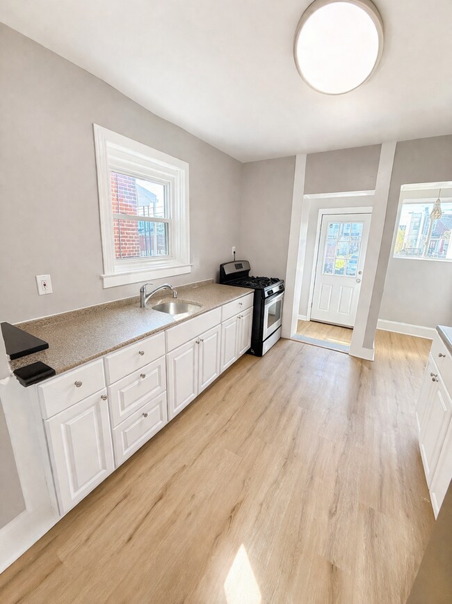 Photo - Beautifully Modern 3BR Townhome | Finished Basement | Fenced Yard | Baltimore